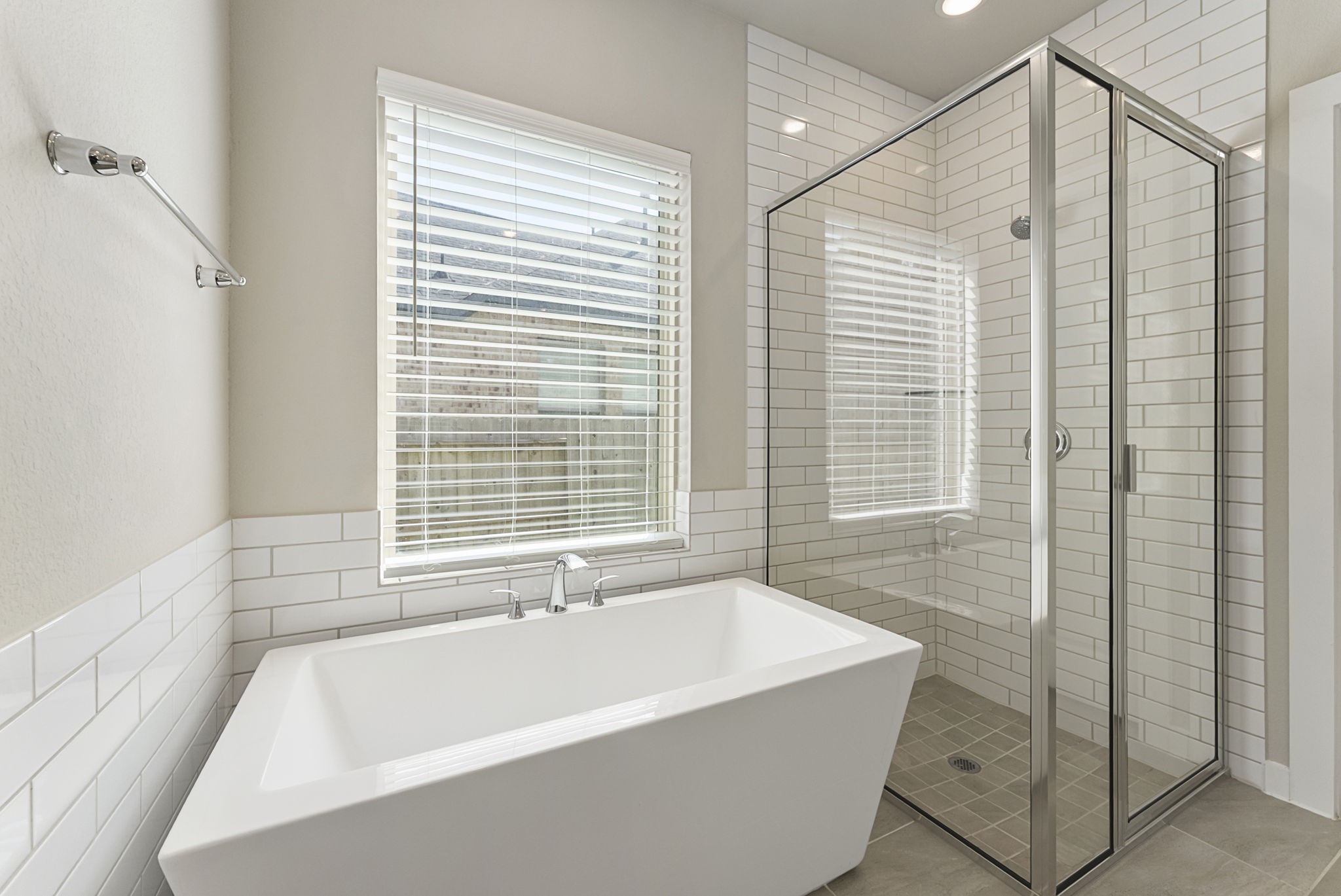 421 Soapberry Tree Court Conroe, TX 77318 - Photo 27 of 50 a bathroom with a bathtub and shower