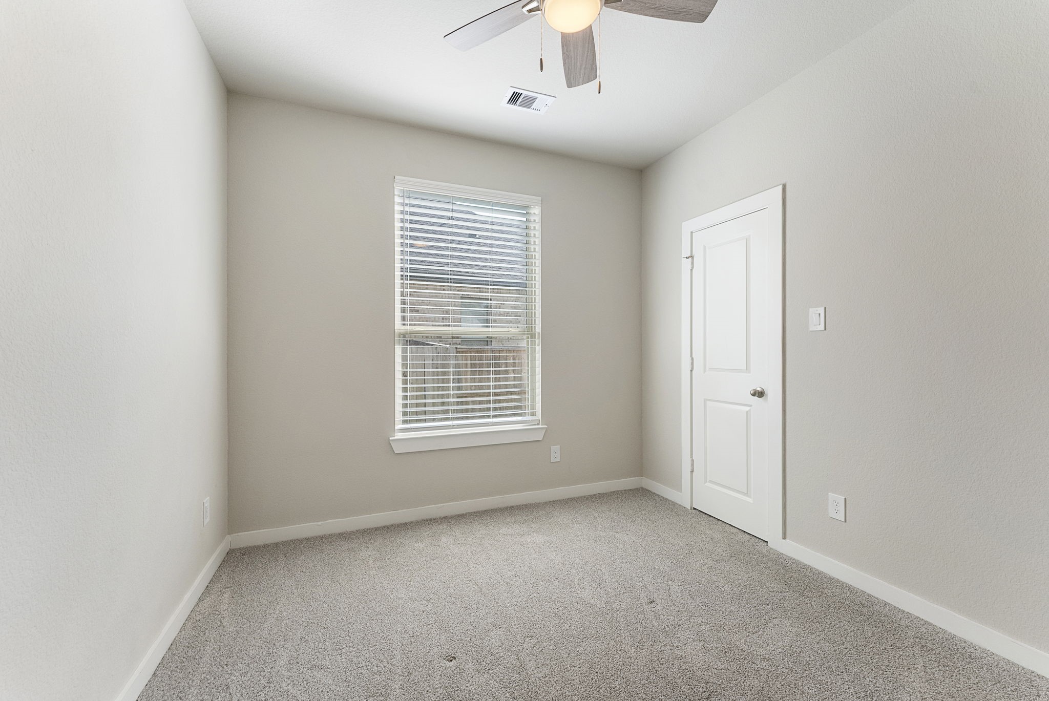 421 Soapberry Tree Court Conroe, TX 77318 - Photo 28 of 50 a view of an empty room with a window