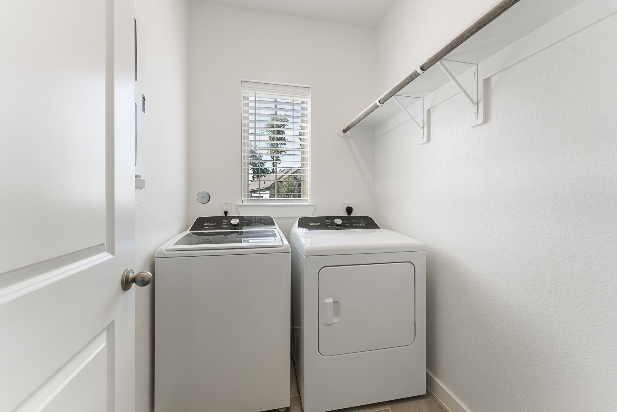 421 Soapberry Tree Court Conroe, TX 77318 - Photo 31 of 50 a utility room with dryer and washer