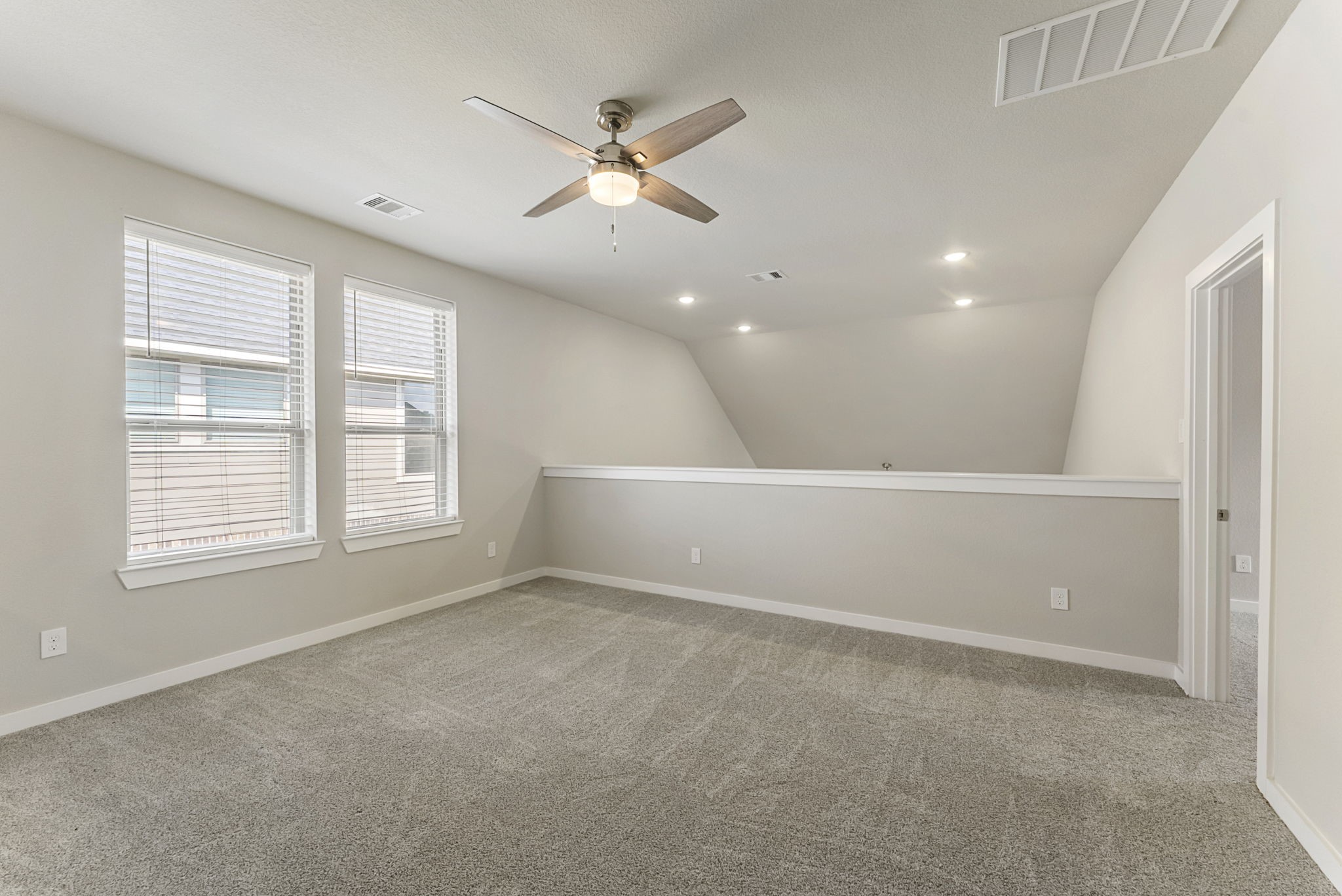 421 Soapberry Tree Court Conroe, TX 77318 - Photo 34 of 50 an empty room with window and ceiling fan