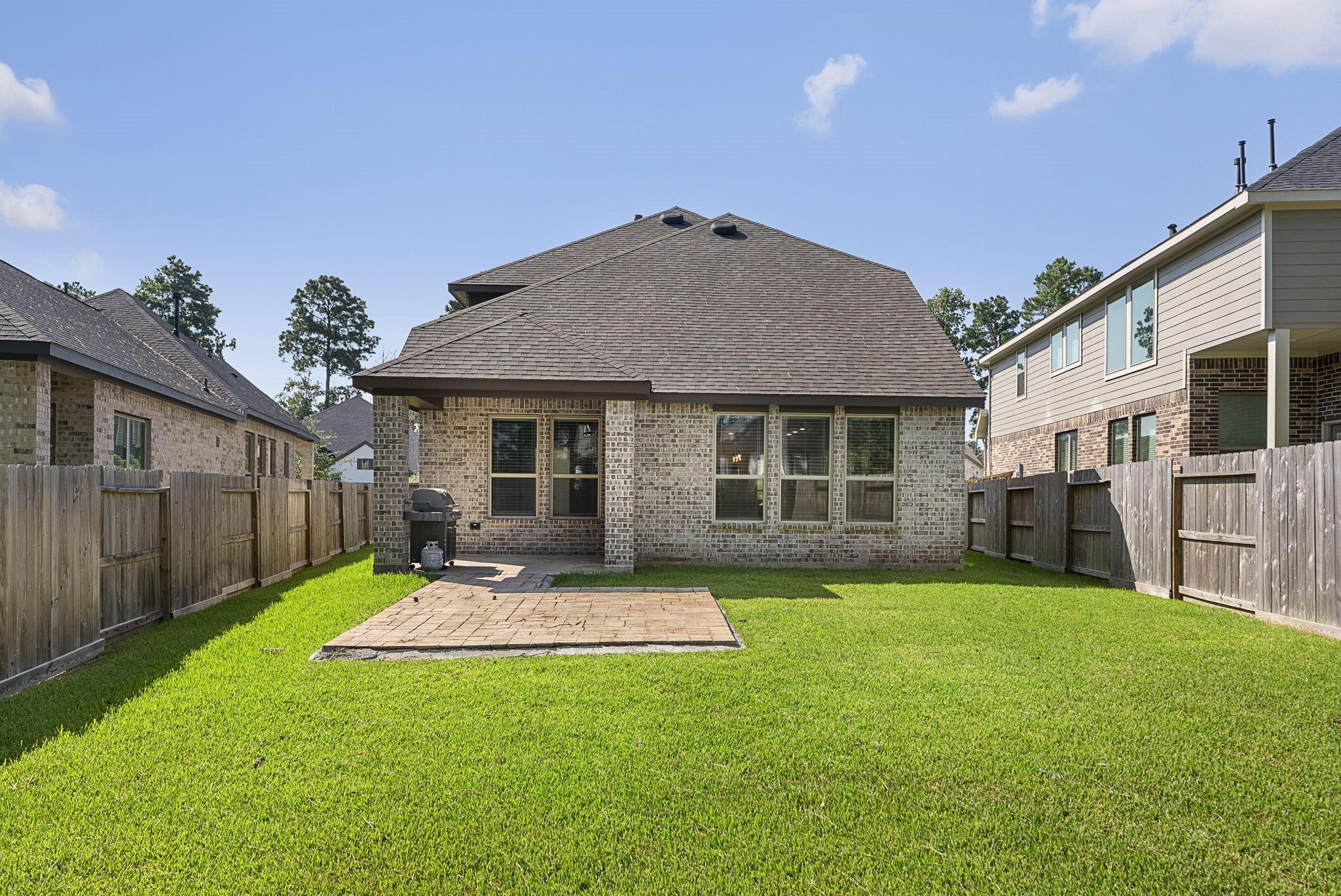 421 Soapberry Tree Court Conroe, TX 77318 - Photo 42 of 50 a view of a house with a yard and pathway