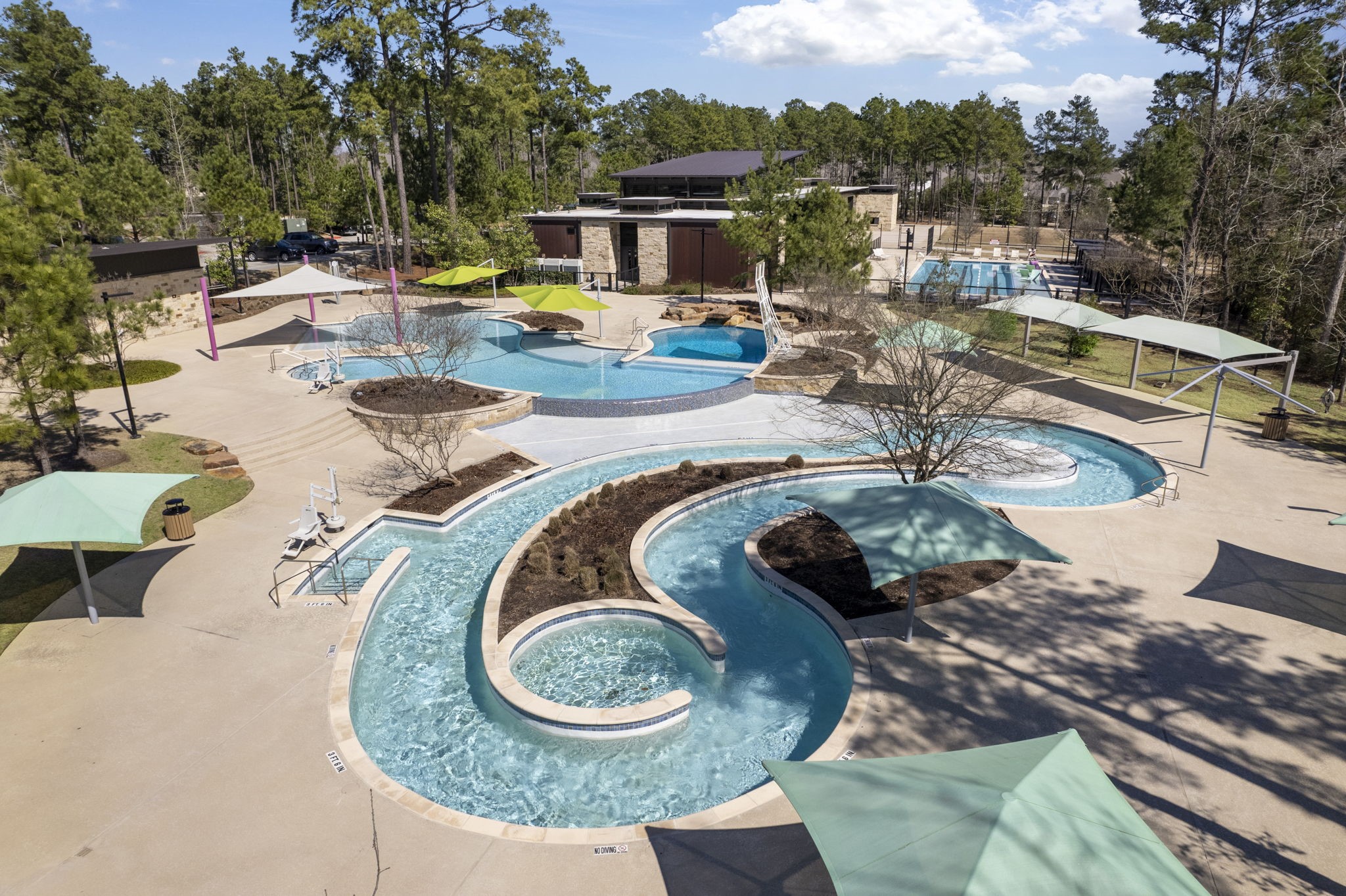 421 Soapberry Tree Court Conroe, TX 77318 - Photo 47 of 50 a view of a swimming pool with a patio