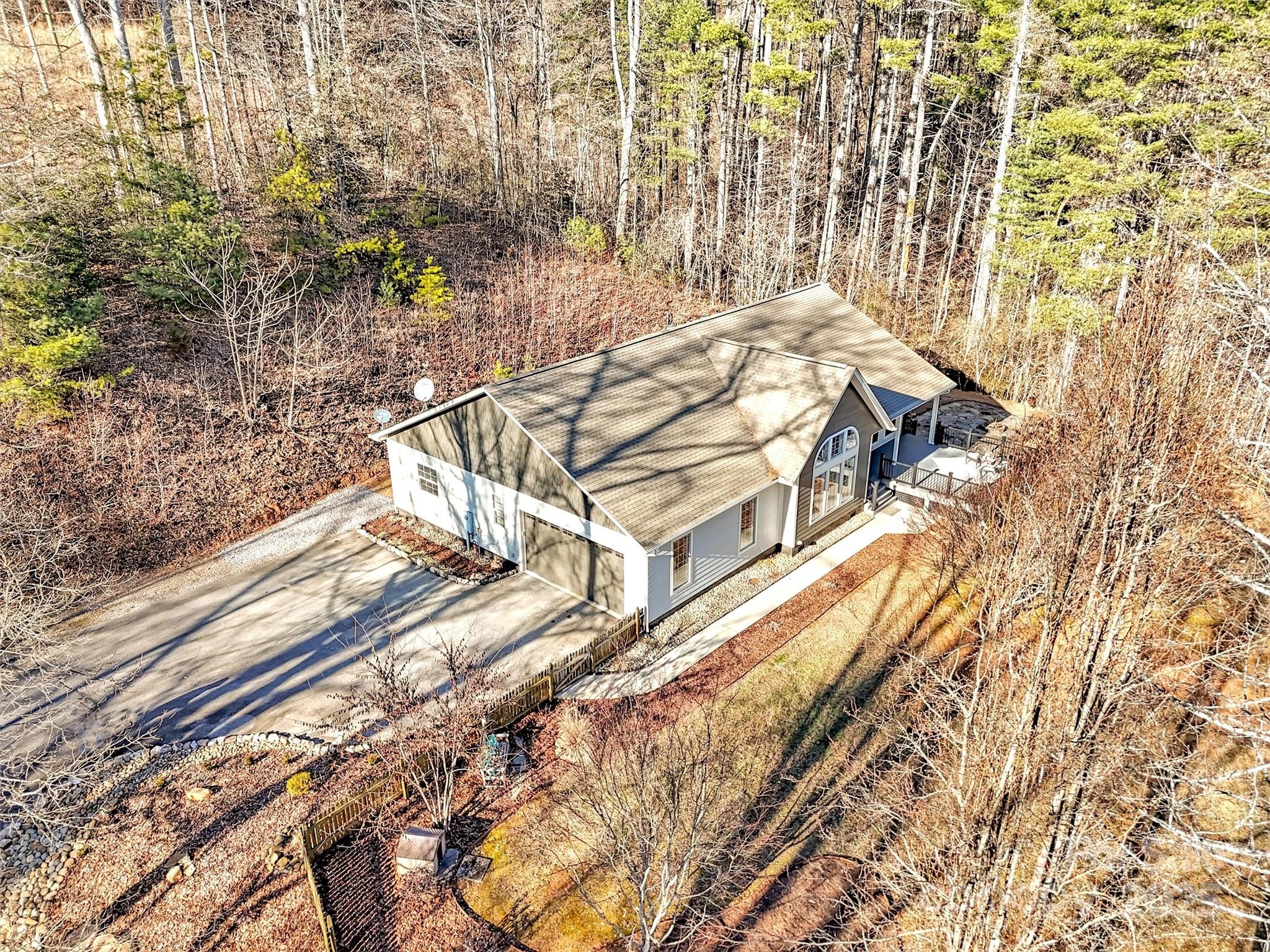 166 Amaroo Ridge, Unit 5 6 Sylva, NC 28779 - Photo 12 of 48 a view of a balcony with a bench