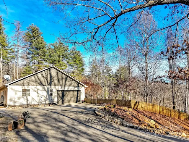 a view of house with a yard