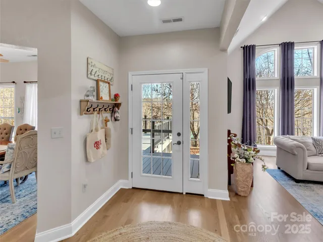 a view of living room filled with furniture and window