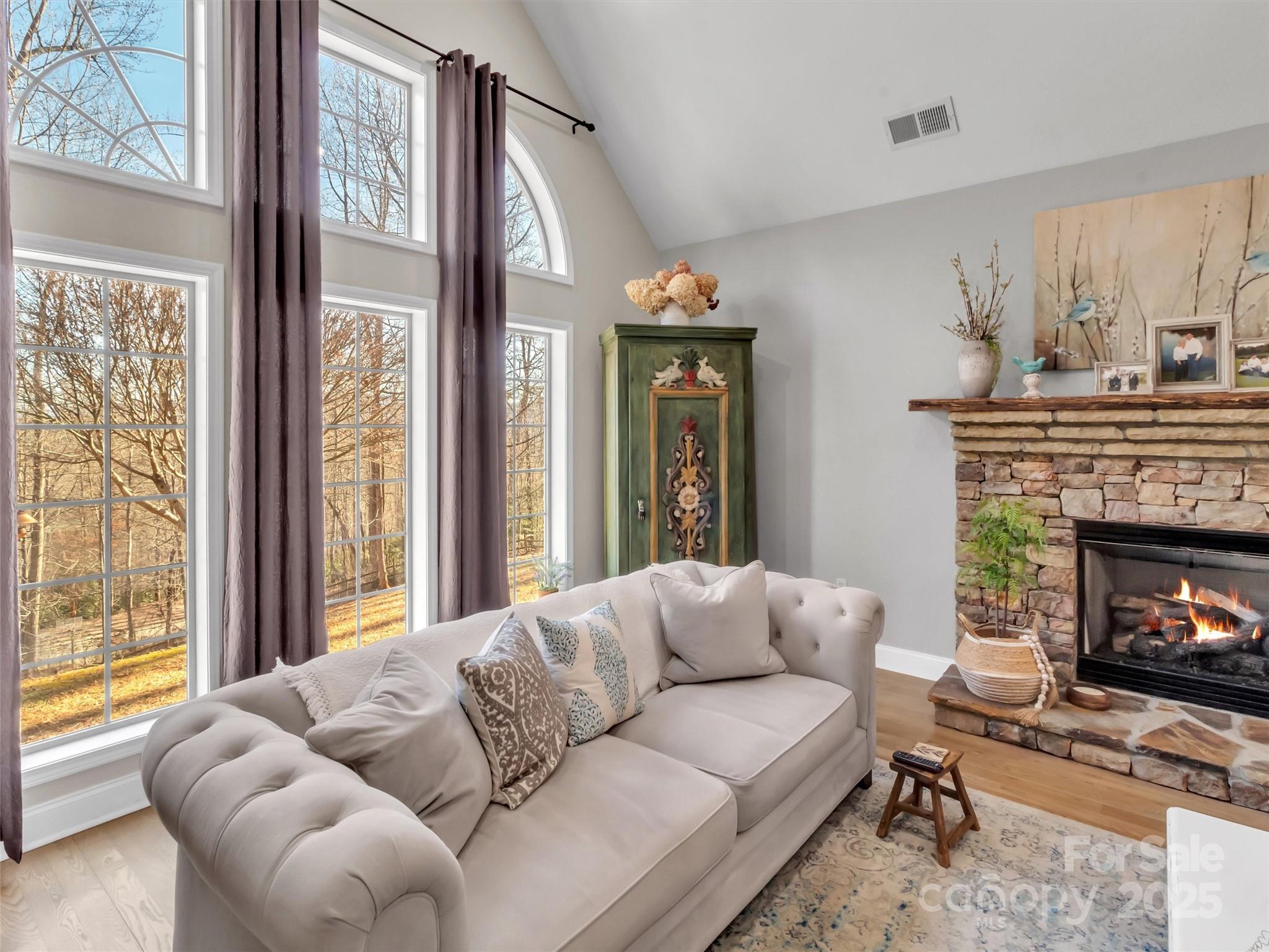 166 Amaroo Ridge, Unit 5 6 Sylva, NC 28779 - Photo 21 of 48 a living room with furniture a fireplace and a large window