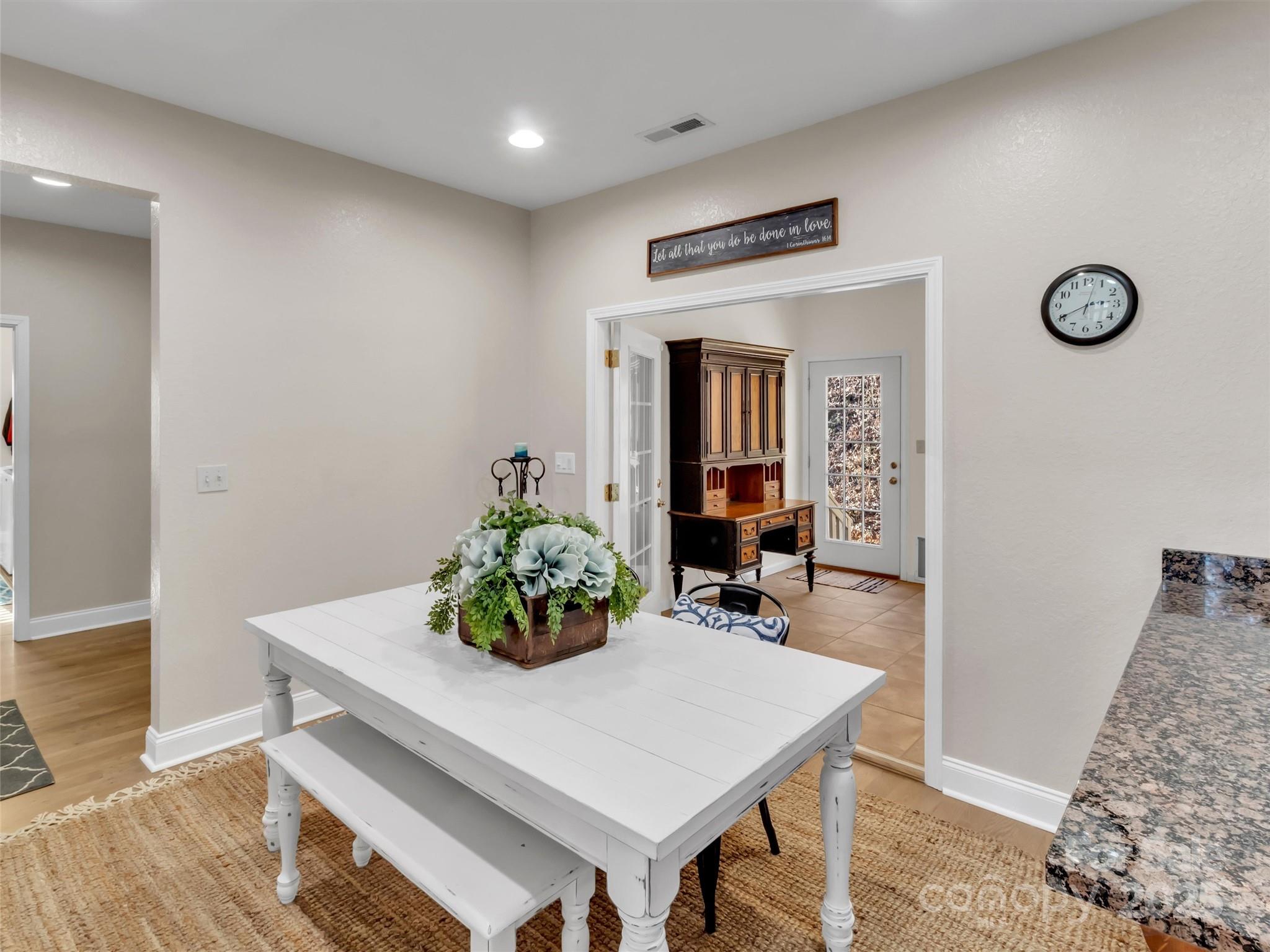 166 Amaroo Ridge, Unit 5 6 Sylva, NC 28779 - Photo 28 of 48 a view of a dining room with furniture and wooden floor