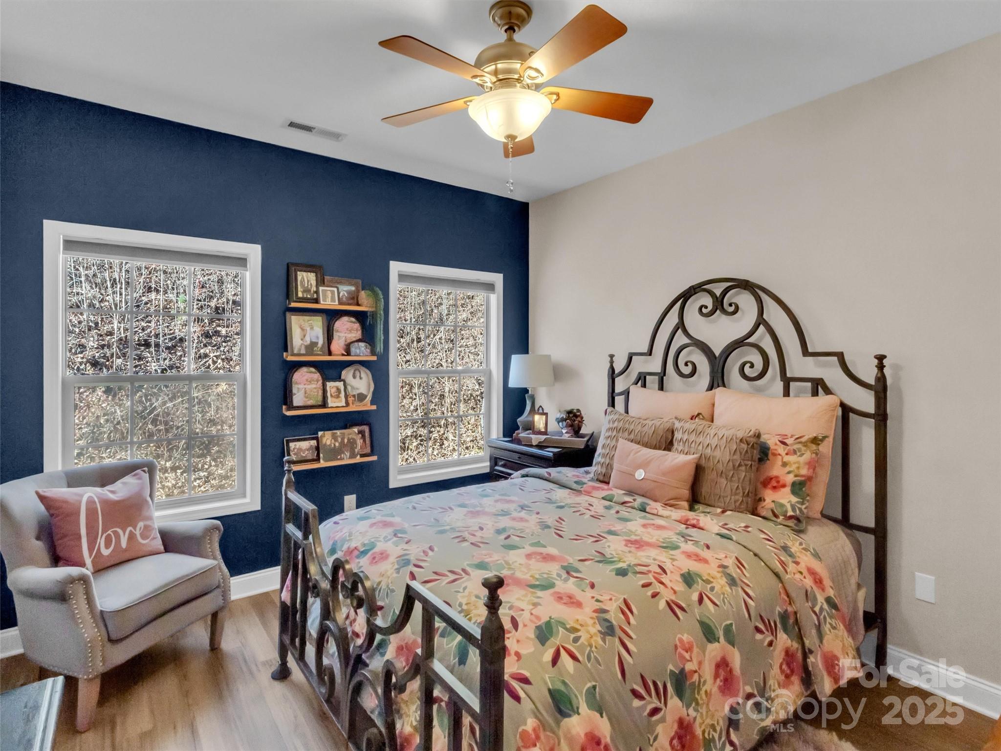 166 Amaroo Ridge, Unit 5 6 Sylva, NC 28779 - Photo 37 of 48 a bedroom with a large bed and a chandelier