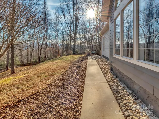 a view of a pathway with a yard