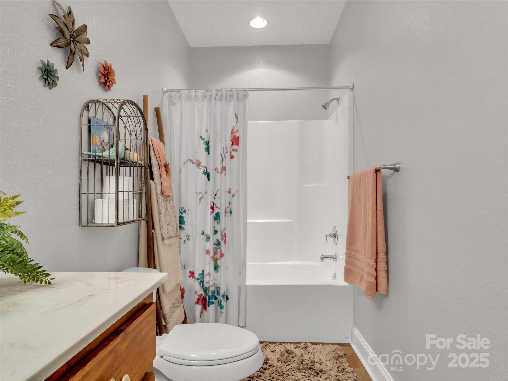 166 Amaroo Ridge, Unit 5 6 Sylva, NC 28779 - Photo 41 of 48 a bathroom with a sink a toilet and shower
