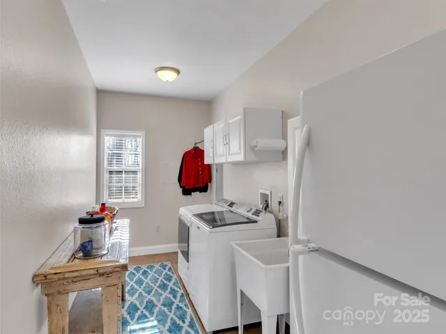 a room with furniture a rug and a window