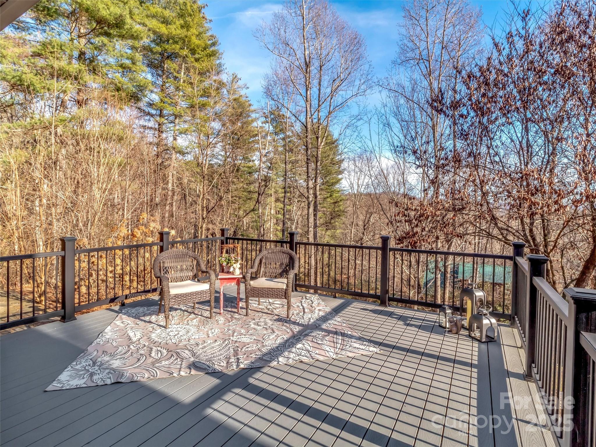 166 Amaroo Ridge, Unit 5 6 Sylva, NC 28779 - Photo 9 of 48 a balcony with chairs and wooden fence
