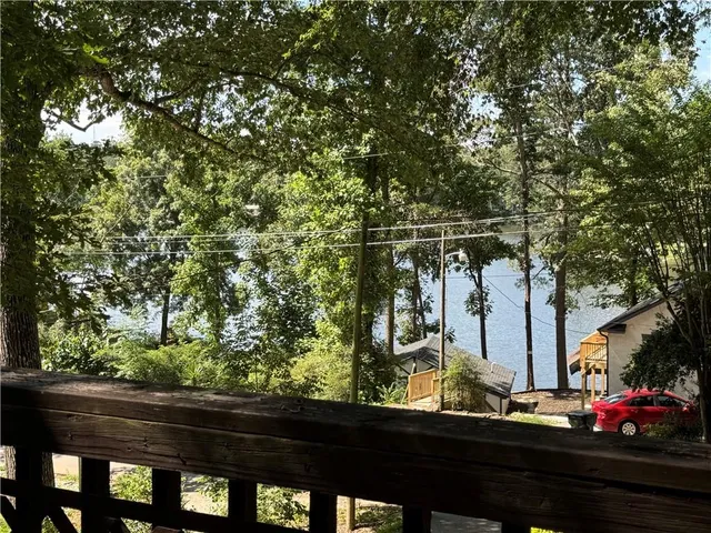 a view of balcony with wooden floor