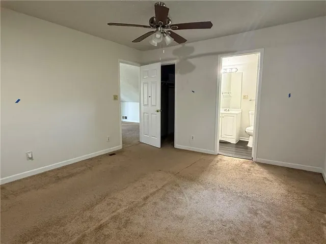 a bathroom with a sink a toilet and a shower