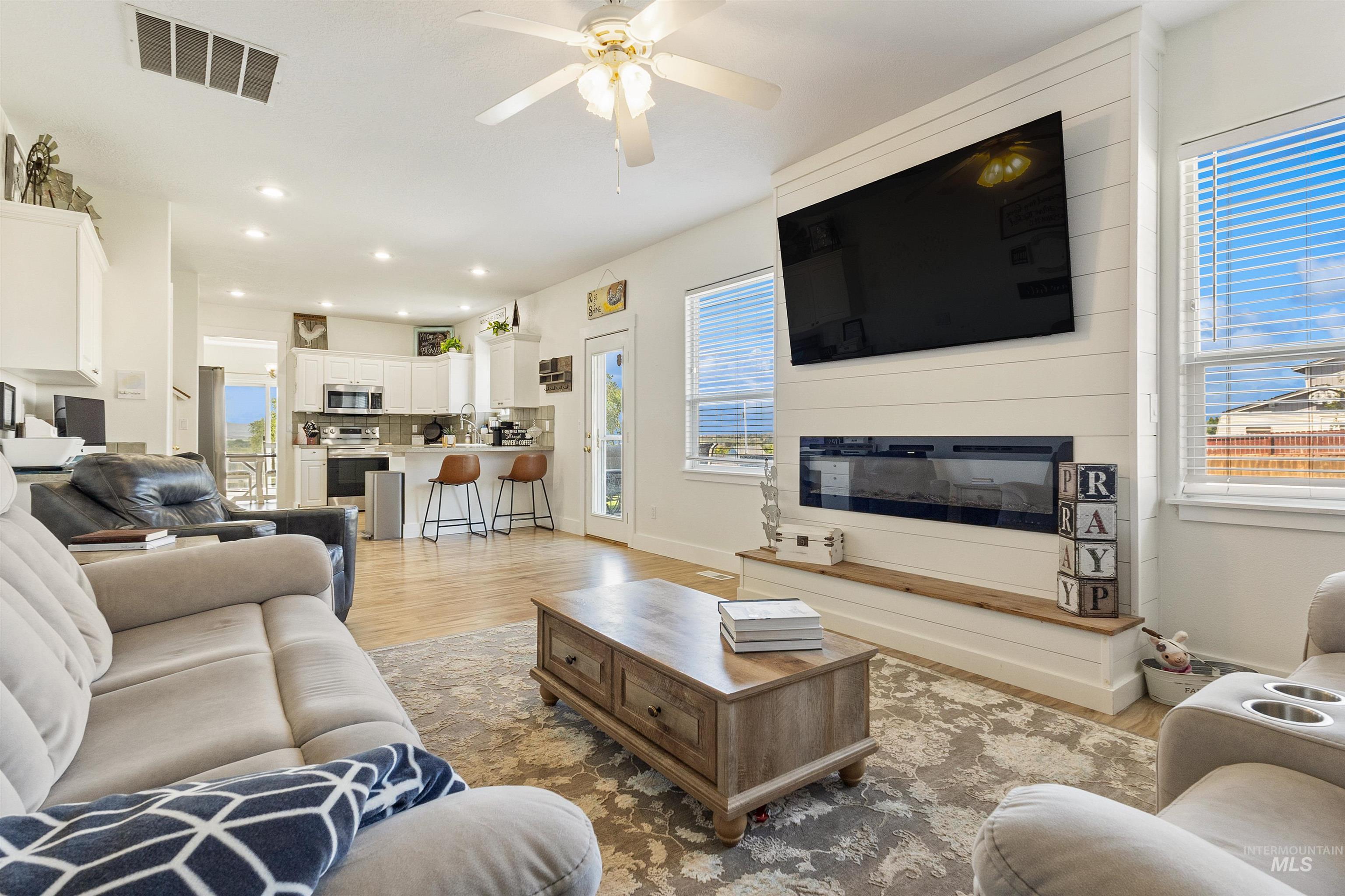 19876 Scotts Lane Caldwell, ID 83607 - Photo 26 of 44 Open-concept living space featuring wood-finish flooring, recessed lighting, and a ceiling fan
