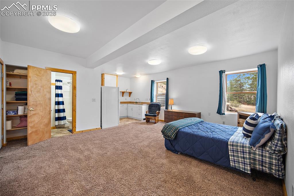 13475 South Hedi Road Sedalia, CO 80135 - Photo 11 of 28 a bedroom with bed and window