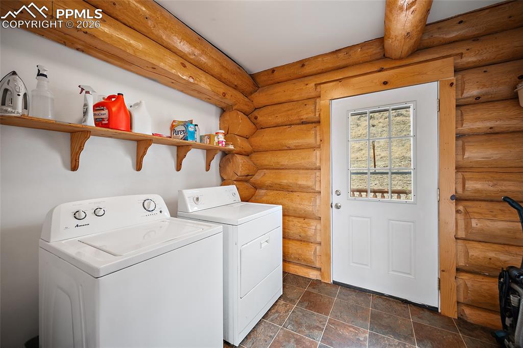 13475 South Hedi Road Sedalia, CO 80135 - Photo 16 of 28 a utility room with dryer and washer