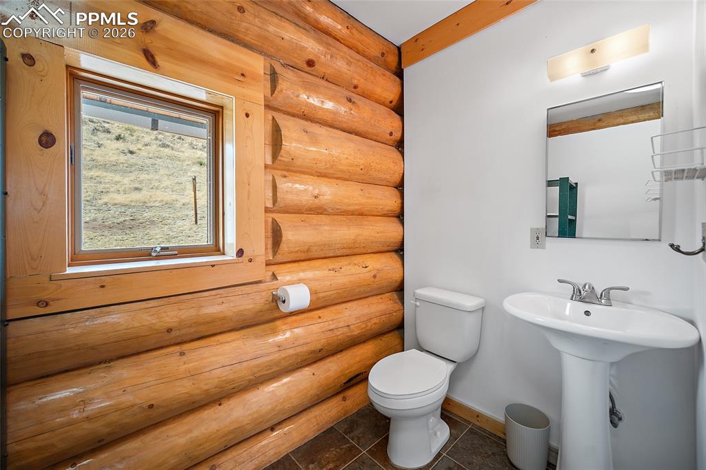13475 South Hedi Road Sedalia, CO 80135 - Photo 17 of 28 a bathroom with a sink toilet and shower