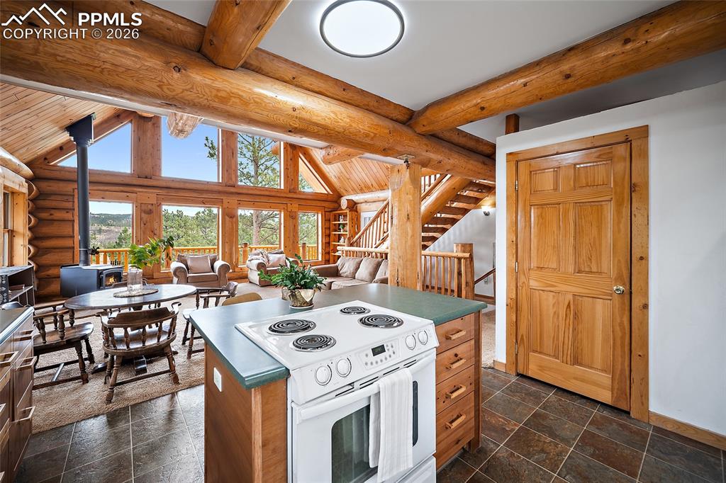 13475 South Hedi Road Sedalia, CO 80135 - Photo 7 of 28 a view of a kitchen with a stove and a refrigerator