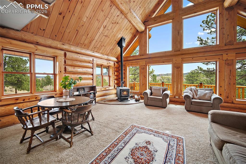 13475 South Hedi Road Sedalia, CO 80135 - Photo 10 of 28 a view of a livingroom with furniture and floor to ceiling window