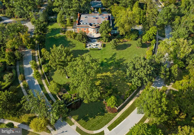 a view of a house with backyard sitting area and garden