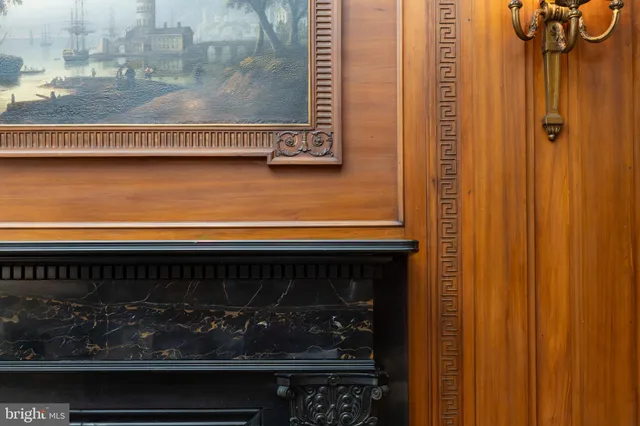 a yellow building with trees in the background