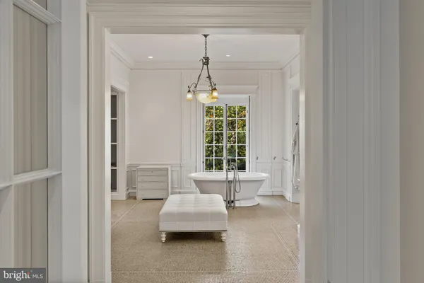 a living room with furniture and a lamp