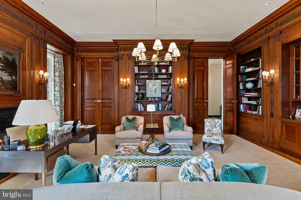 a spacious bedroom with a bed and large windows