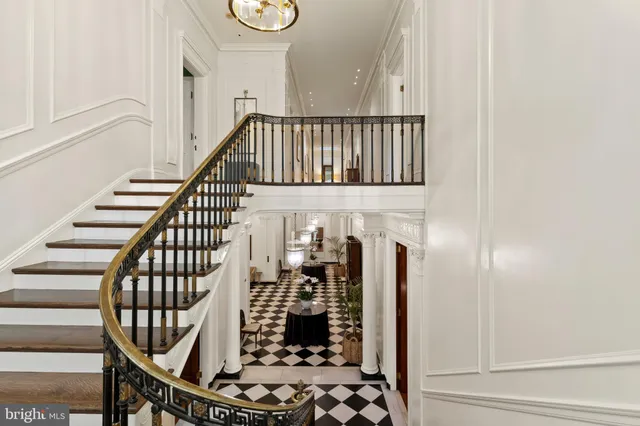 a view of a hallway with wooden floor and entryway