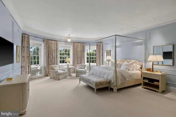 a living room with furniture a couch and wooden floor