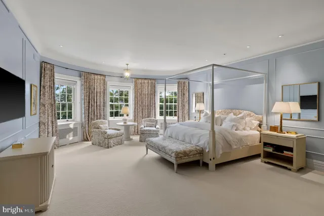 a living room with furniture a couch and wooden floor