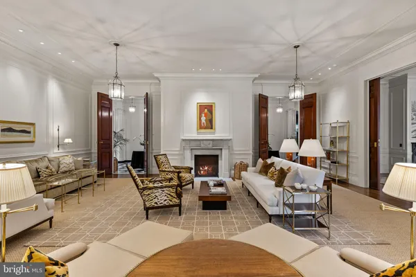 an aerial view of a house with garden space and trees all around