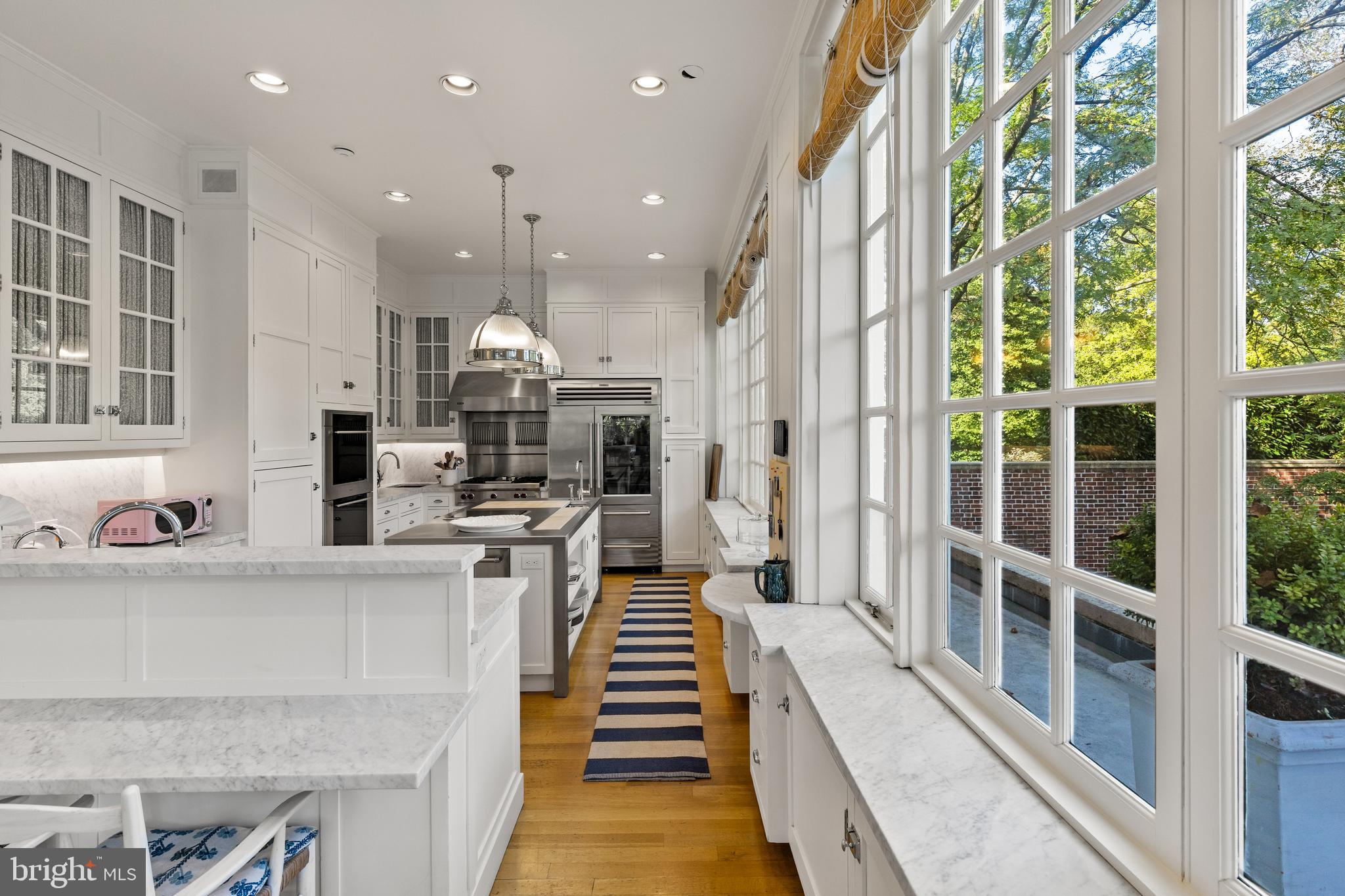 15 Charlcote Place Baltimore, MD 21218 - Photo 60 of 68 a kitchen with stainless steel appliances kitchen island granite countertop a stove and a sink