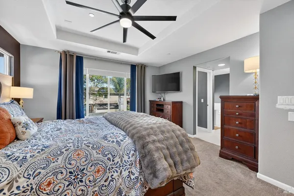 a spacious bathroom with a granite countertop sink and a large mirror