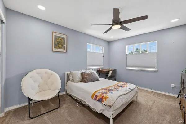 a bedroom with a bed and a desk