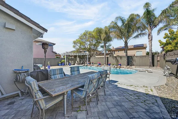 a view of a backyard with sitting area