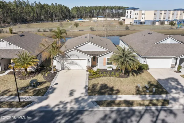 a view of a yard and front view of house