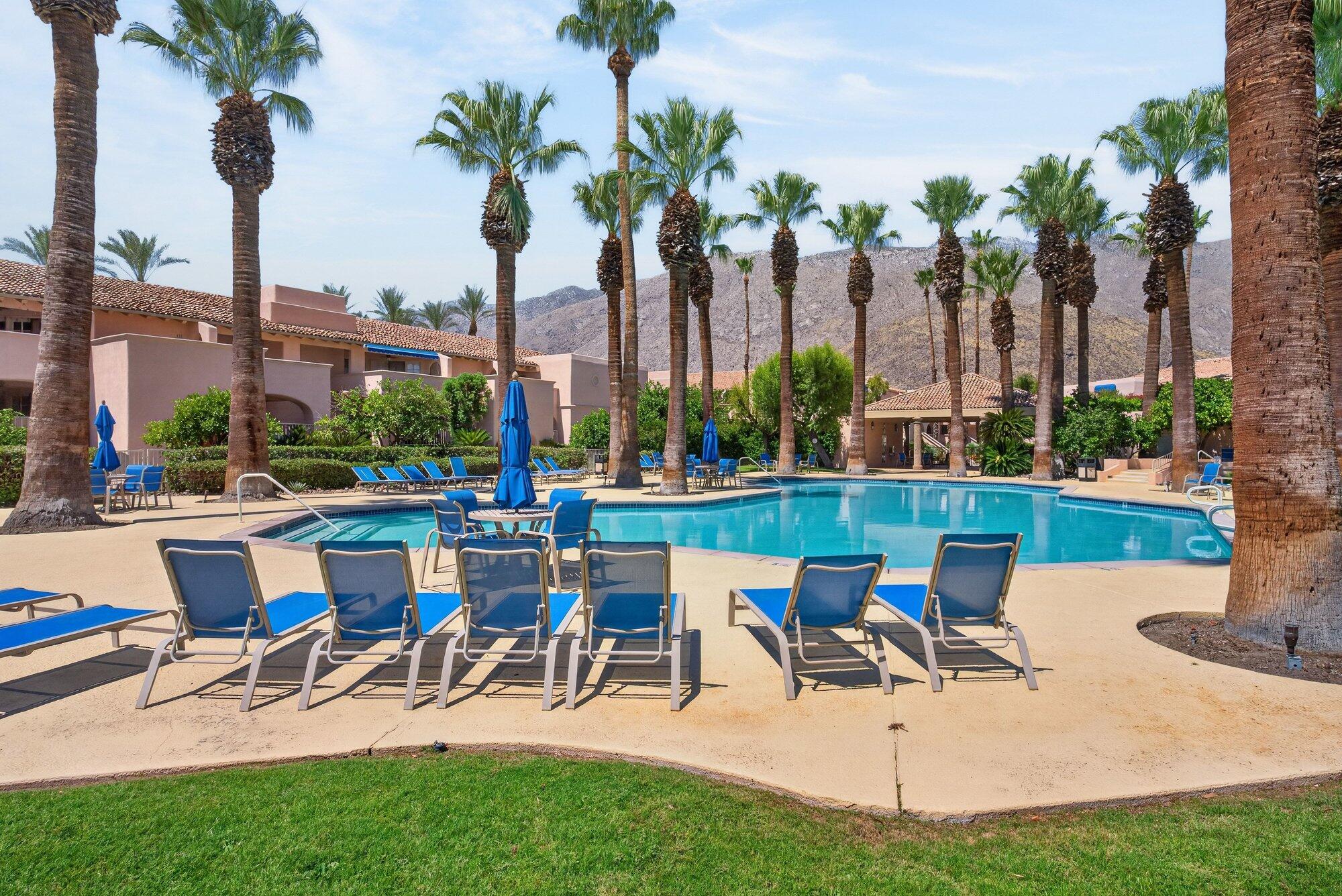 500 East Amado Road, Unit 313 Palm Springs, CA 92262 - Photo 1 of 32 a view of a yard with a patio and swimming pool