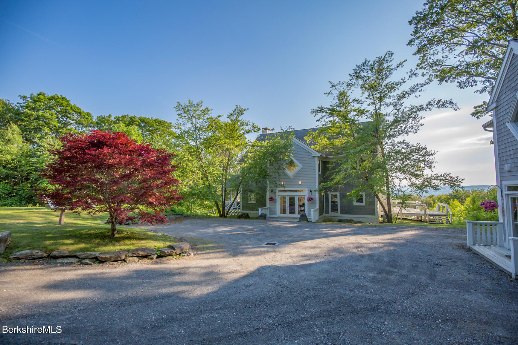 169 Mt Hunger Road Monterey, MA 01245 - Photo 1 of 51 a front view of a house with a yard and a big yard