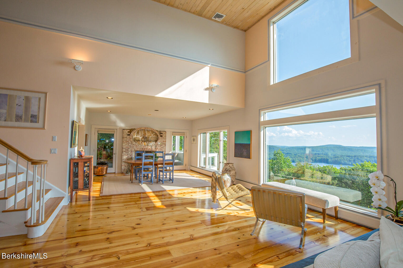 169 Mt Hunger Road Monterey, MA 01245 - Photo 11 of 51 a living room with fireplace furniture and a large window
