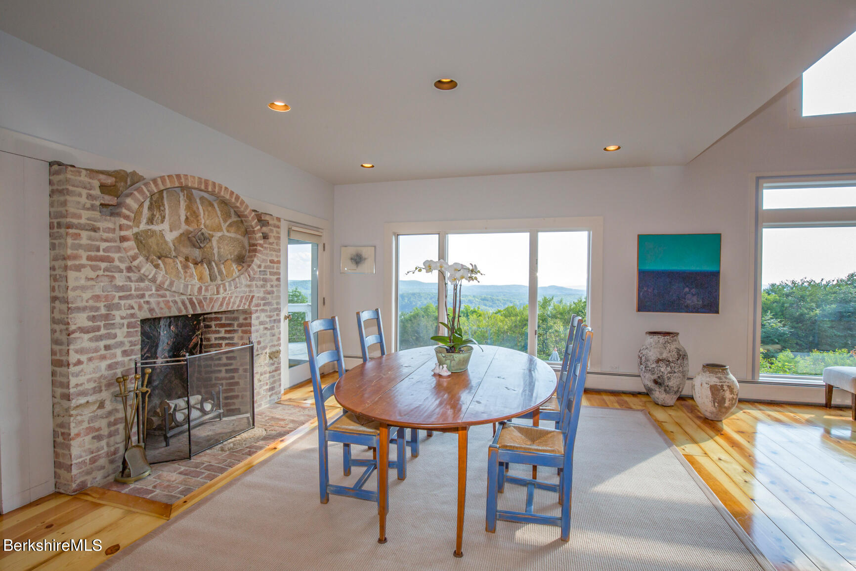 169 Mt Hunger Road Monterey, MA 01245 - Photo 14 of 51 a living room with furniture a fireplace and a floor to ceiling window