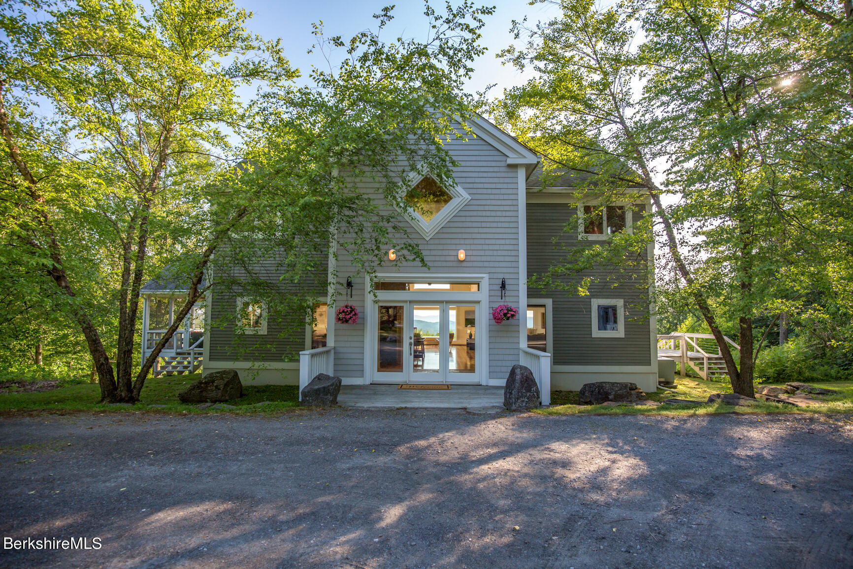 169 Mt Hunger Road Monterey, MA 01245 - Photo 2 of 51 a front view of a house with a yard and garage