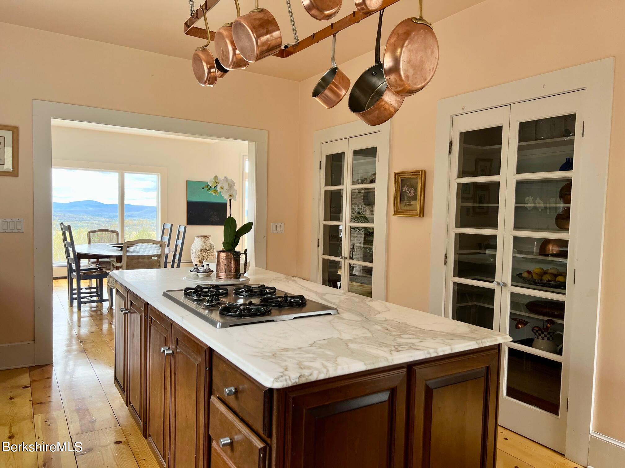 169 Mt Hunger Road Monterey, MA 01245 - Photo 23 of 51 a kitchen with a stove a counter space a sink and appliances
