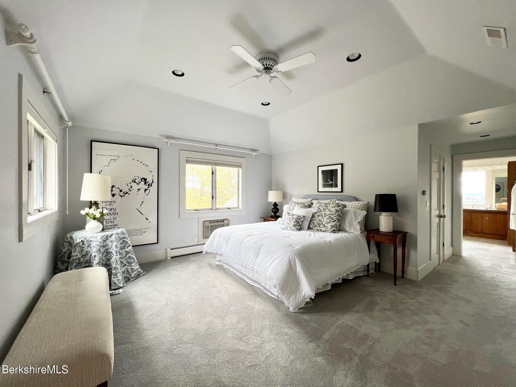 169 Mt Hunger Road Monterey, MA 01245 - Photo 27 of 51 a bed room with a bed and a chandelier