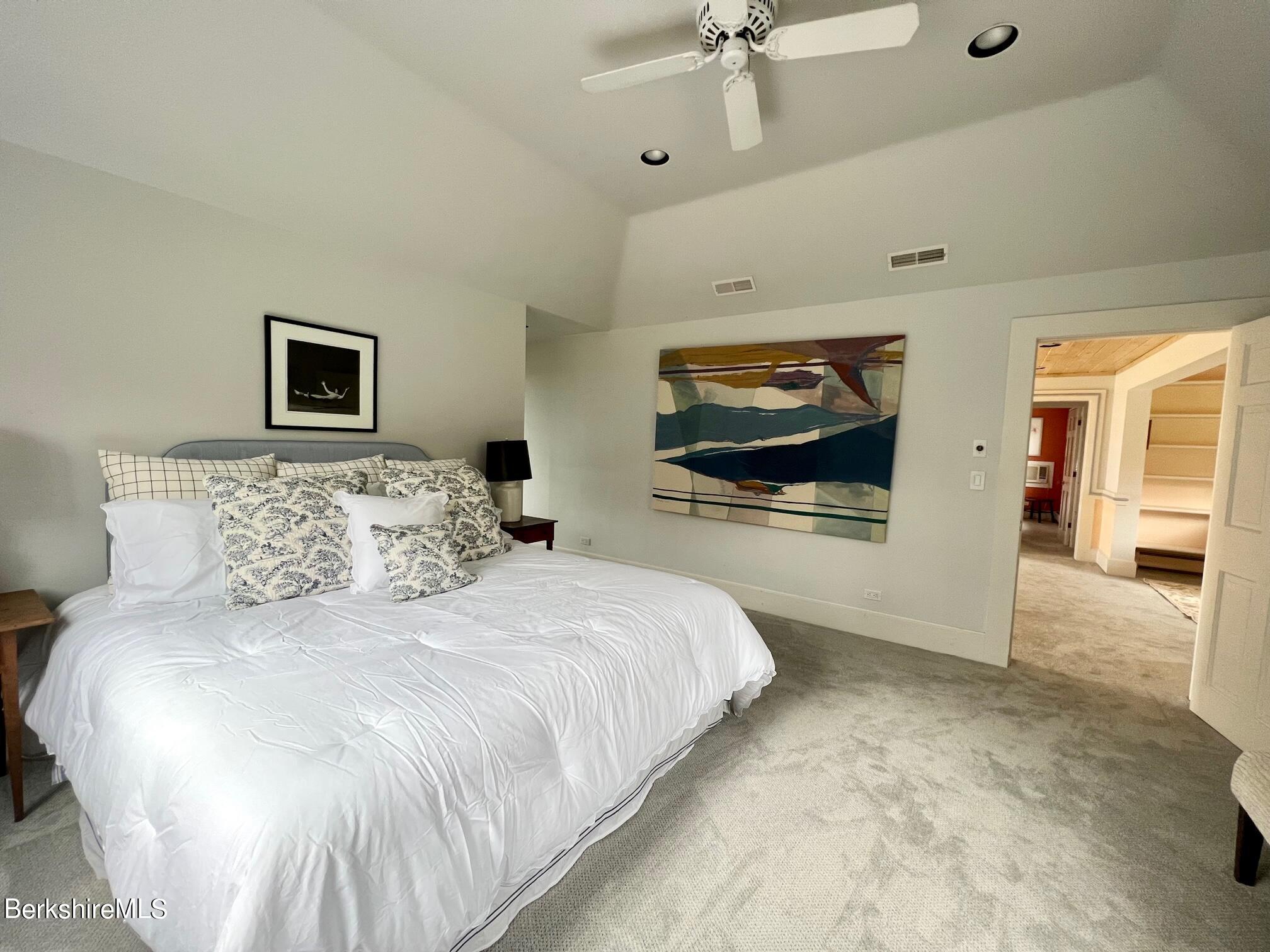 169 Mt Hunger Road Monterey, MA 01245 - Photo 28 of 51 a bedroom with a bed and a flat screen tv