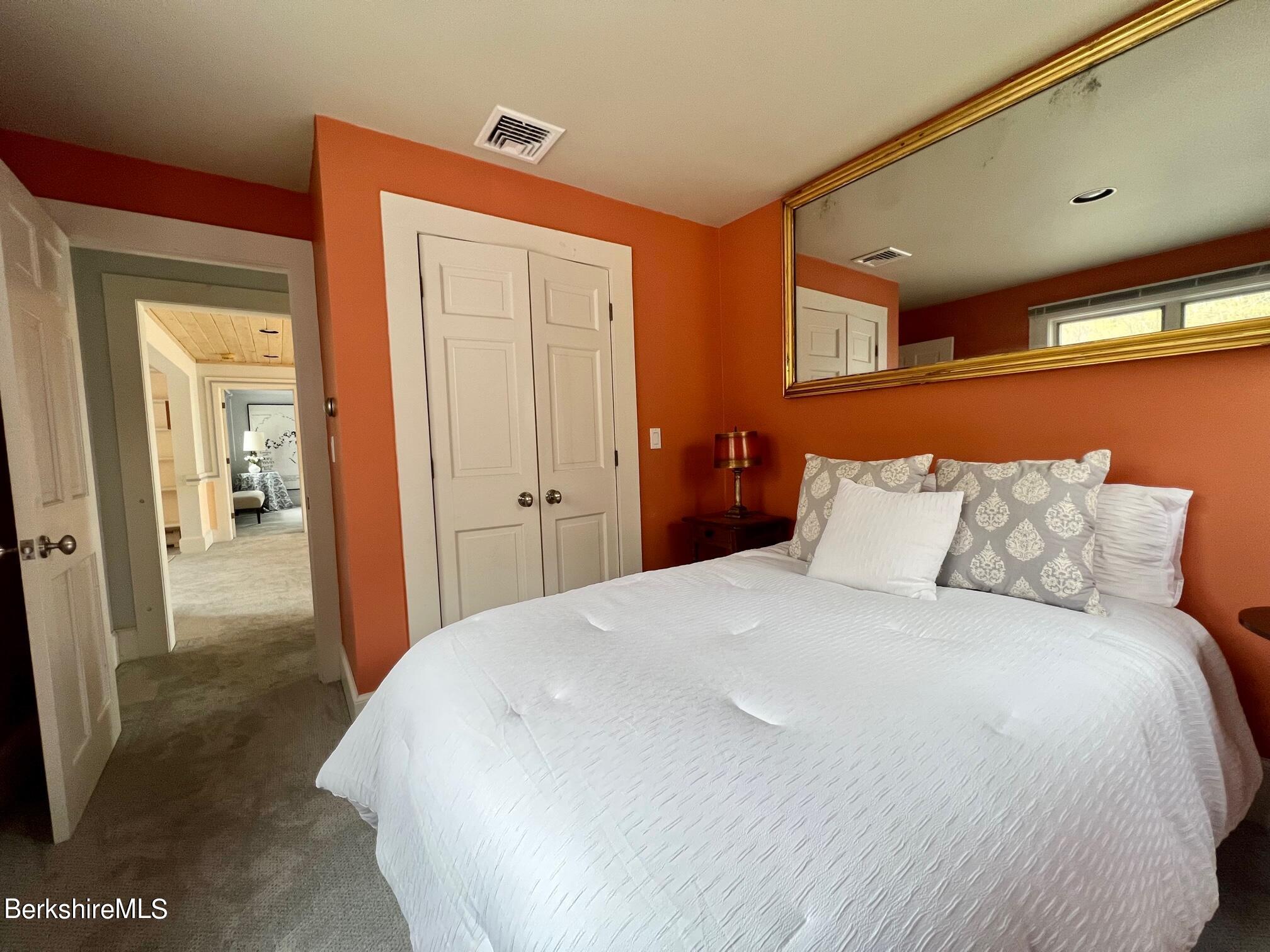 169 Mt Hunger Road Monterey, MA 01245 - Photo 36 of 51 a large bed in a white room