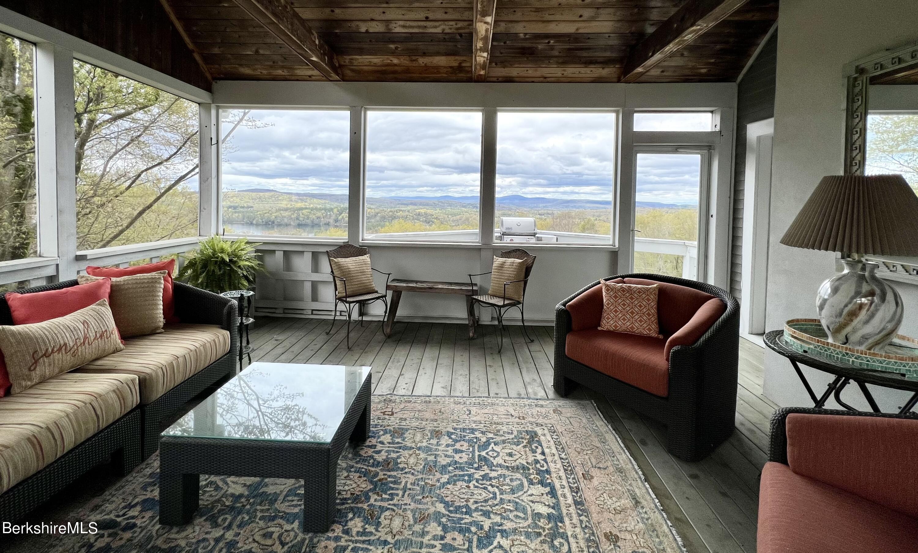 169 Mt Hunger Road Monterey, MA 01245 - Photo 39 of 51 a living room with furniture and a large window