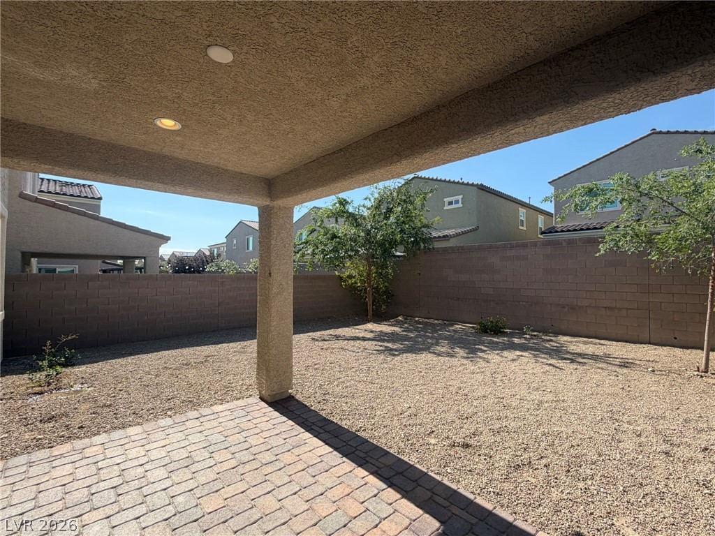 9953 Tucket Point Court Las Vegas, NV 89178 - Photo 10 of 22 A spacious backyard with a covered patio offers ample outdoor living potential.