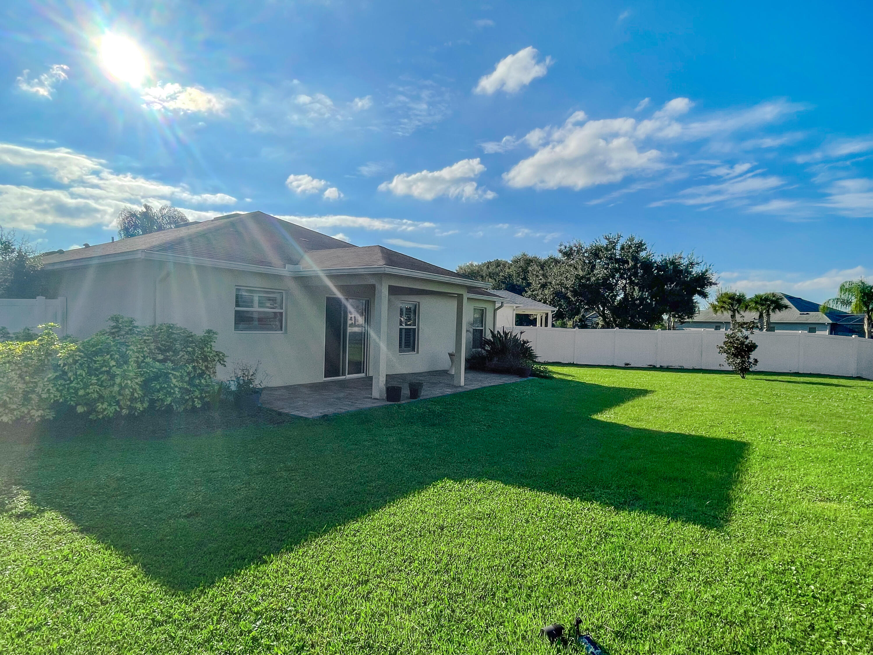 1641 Strathmore Circle Mount Dora, FL 32757 - Photo 17 of 21 a front view of a house with a garden