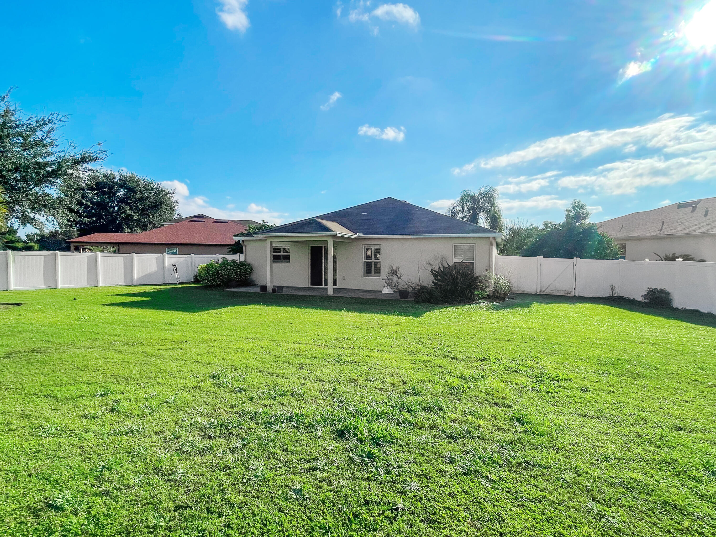 1641 Strathmore Circle Mount Dora, FL 32757 - Photo 18 of 21 a view of an house with backyard space and balcony